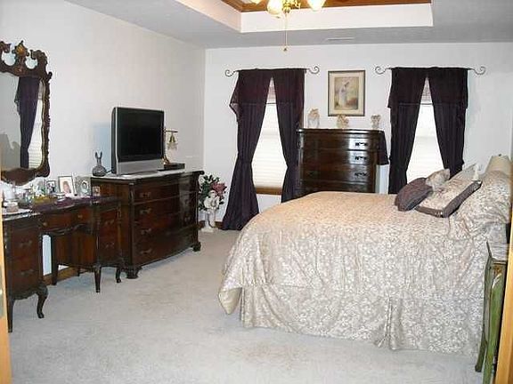 Spacious master with custom tray ceiling.