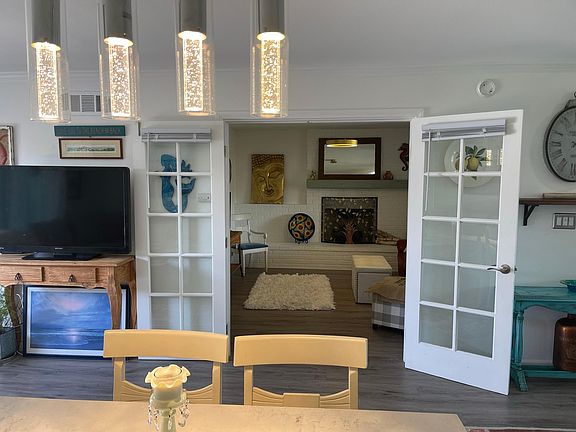 French doors open to guest room/2nd bedroom or done with fireplace