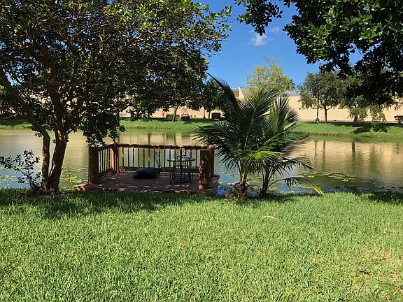 Expansive Side and back yard with lake access and private do