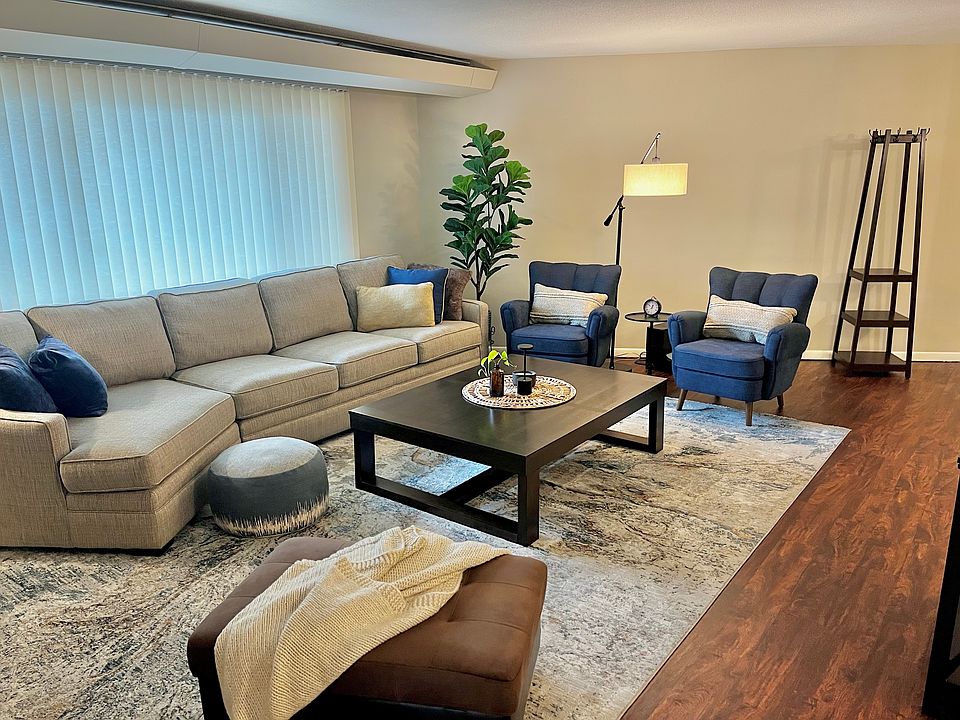A spacious living room with an oversized couch