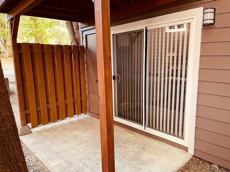 Private patio area with outside storage locker.