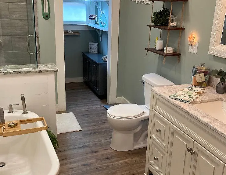 Primary bathroom with soaking tub, walk in shower, and walk in closet