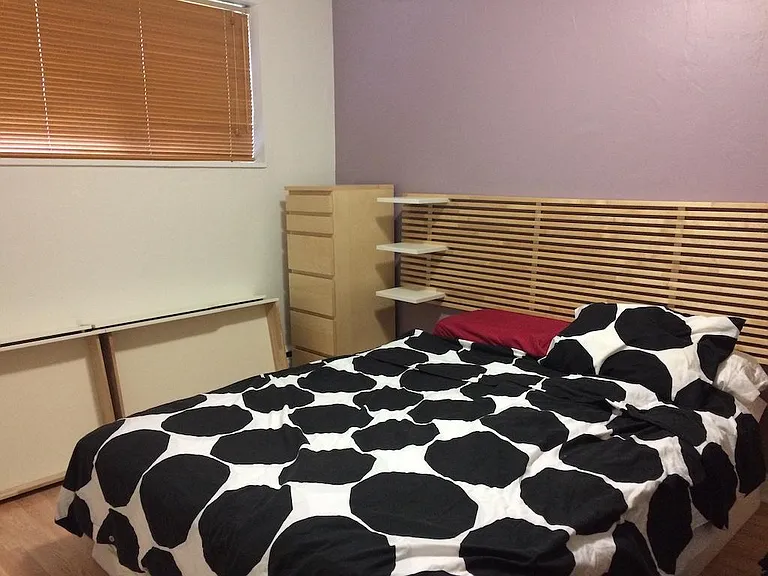 Bedroom, facing window, as previously furnished (blinds included; queen size bed and cabinets not included)