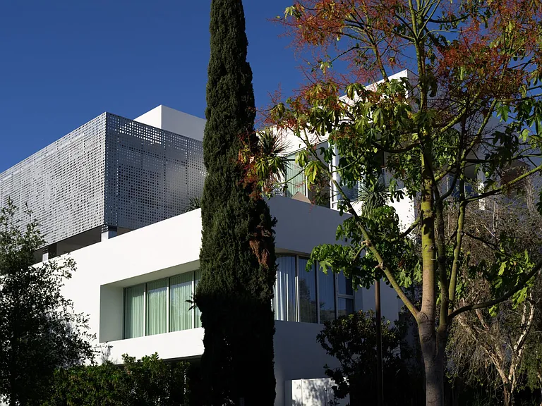 Integrated Landscape and Architecture _ The building's facade harmonizes with the surrounding greenery, offering a seamless connection to nature while maintaining a distinctly modern edge.