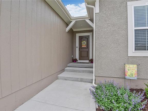 The front porch area is helpful to keep visitors covered in inclement weather.