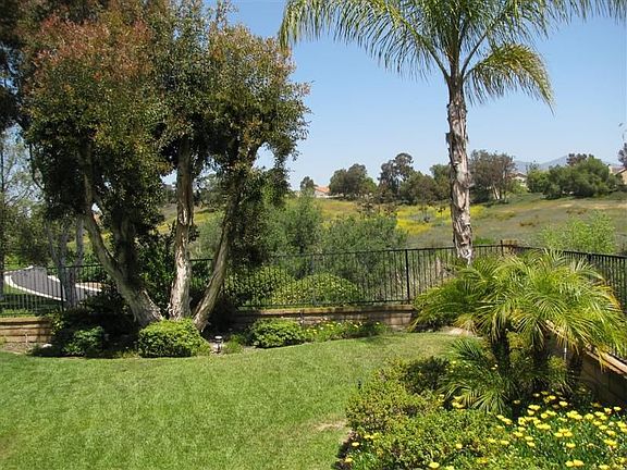 View of backyard & arroyo no homes located behind this property. 