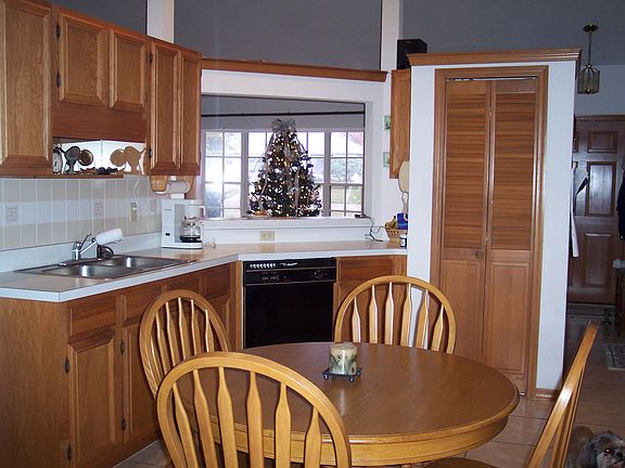 Oak cabinets, pantry, sliders to lanai