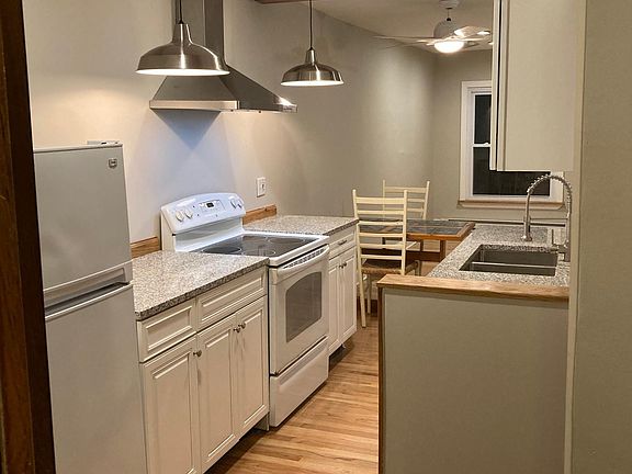 View looking back to the living room with pantry door on your left.