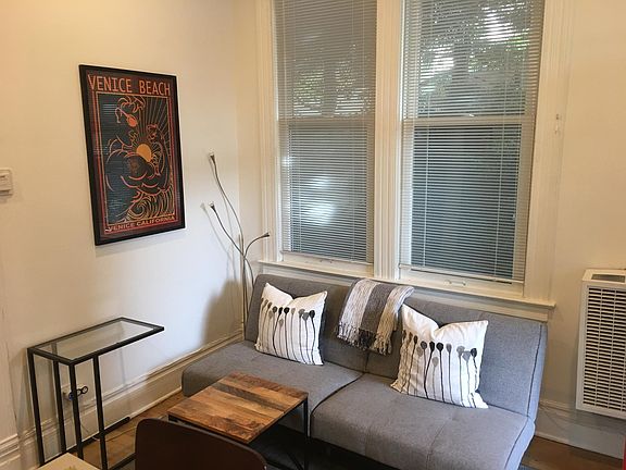Fold out futon couch. Has wall heater .