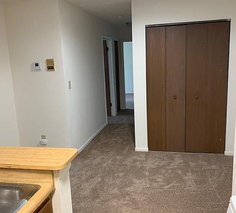 Dining area- behind the brown doors is the furnace and hot water tank