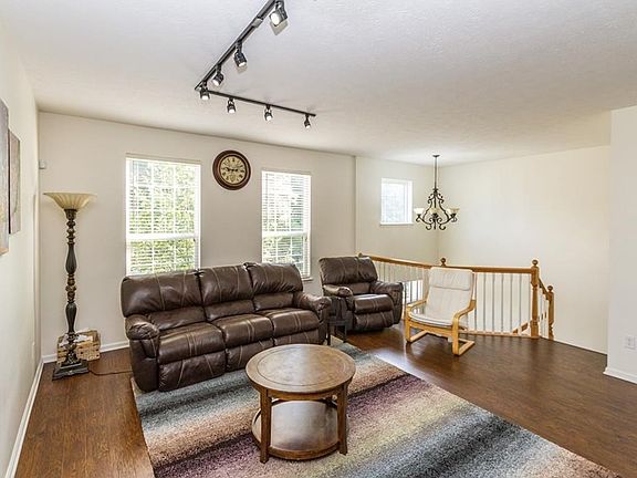 Large, bright living room with two story entry