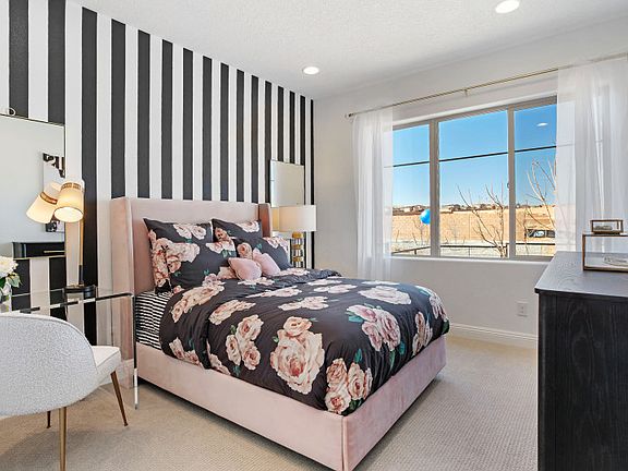 Second bedroom features a large window for plenty of natural light.