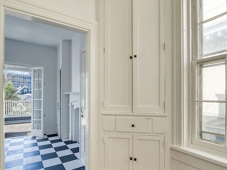 Corner cabinet storage adjacent to kitchen