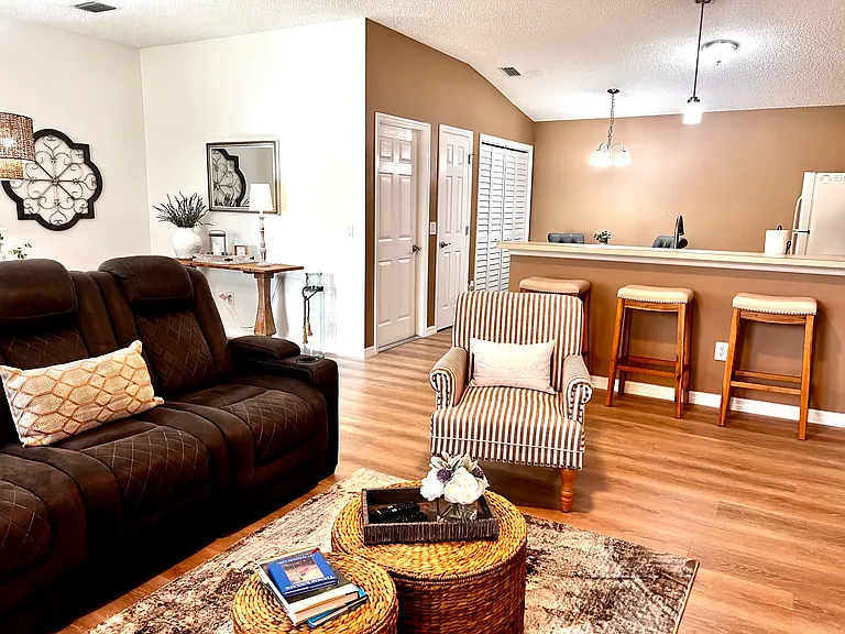 Living Room with eat in kitchen and bar top.