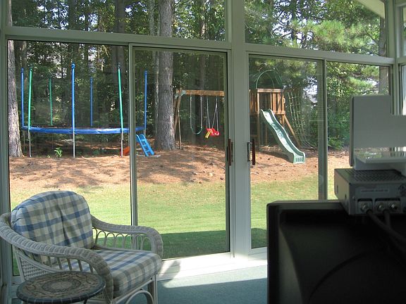 Solarium Overlooks Spacious Backyard
