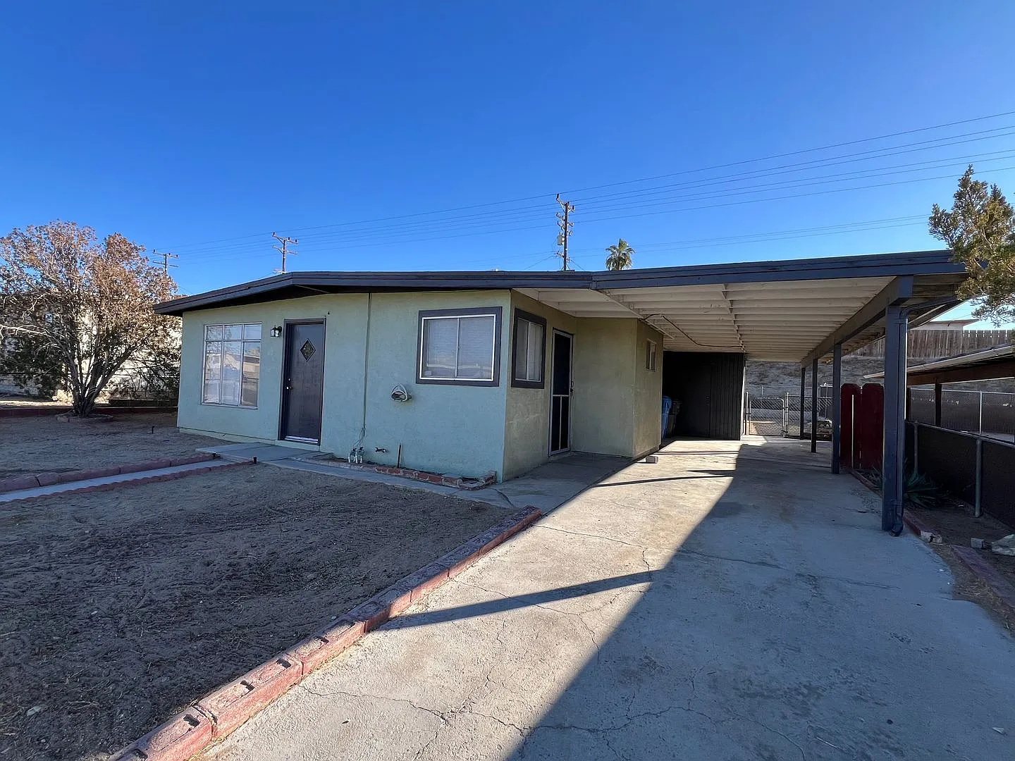 3 Bedroom House with New Paint, Wood Flooring & Carport — Photo 4