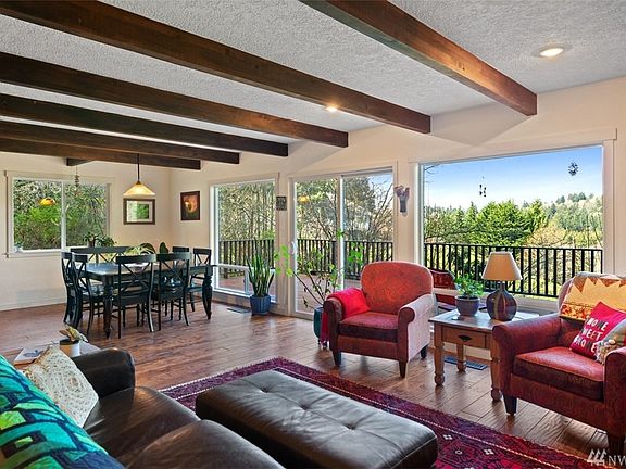 Relish in idyllic nature views out every window while taking in the cozy natural interior features