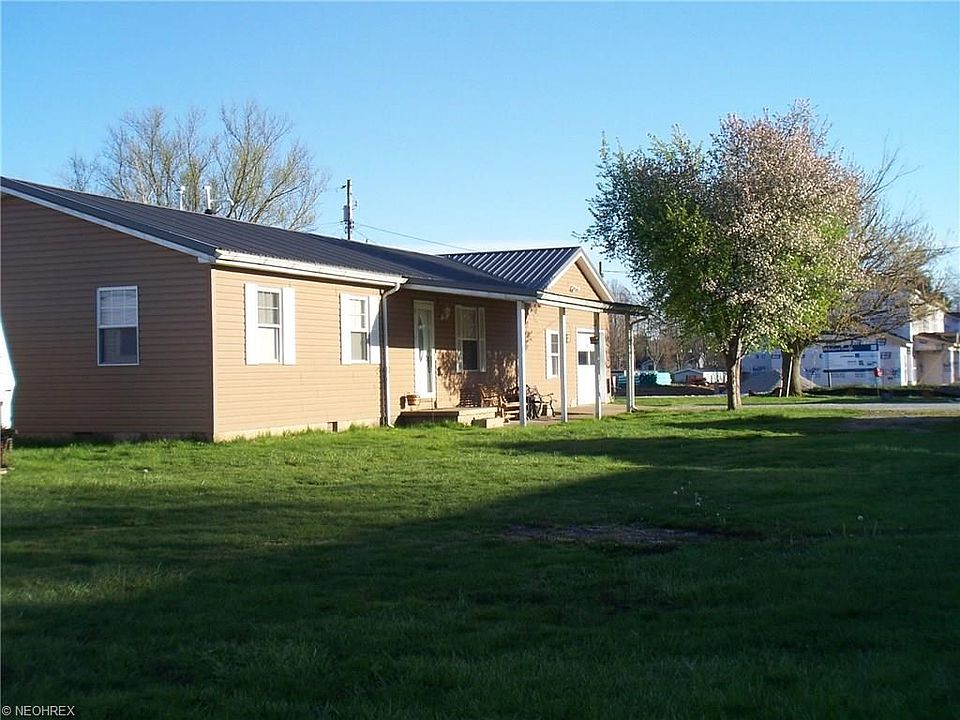 Side and front.  Large level lot.
