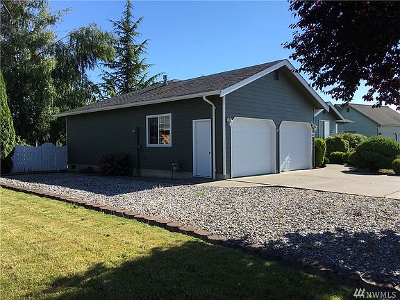 2 car garage, both doors with garage door openers. Extra gravel parking area for your toys!