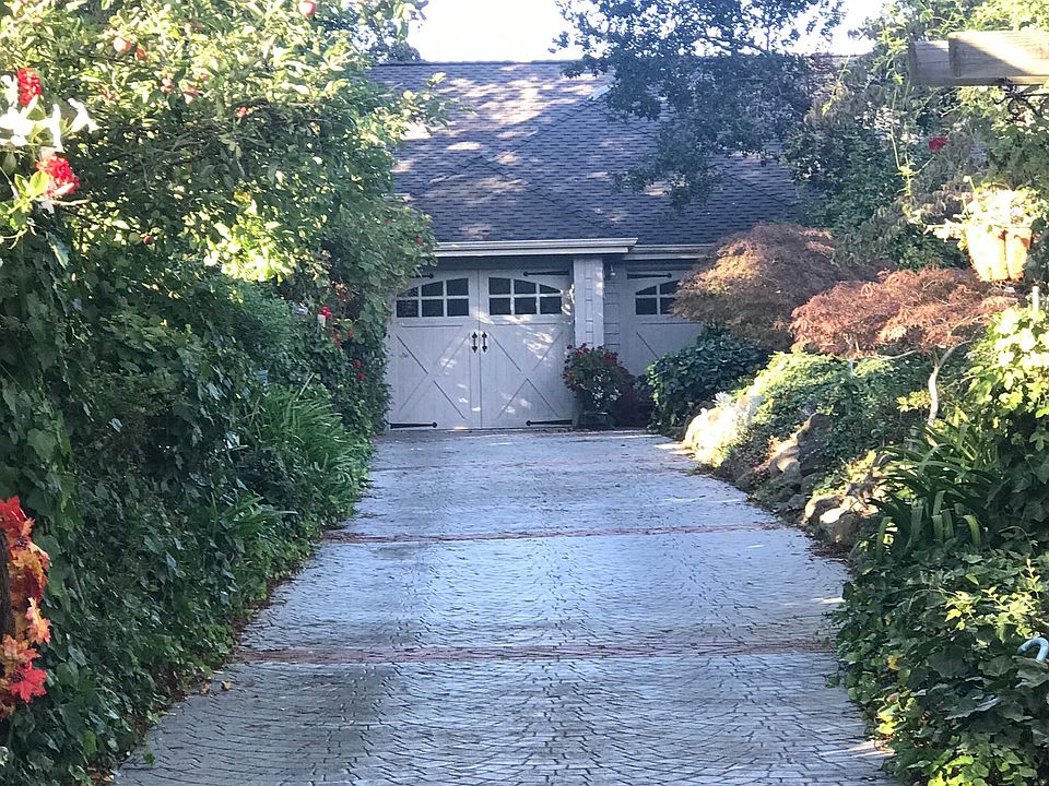 Entrance to cottage on the side of garage. Not a garage conversion. A separate cottage