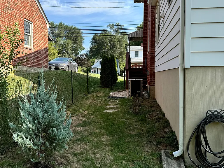 West Elevation to side door from Kitchen to backyard.