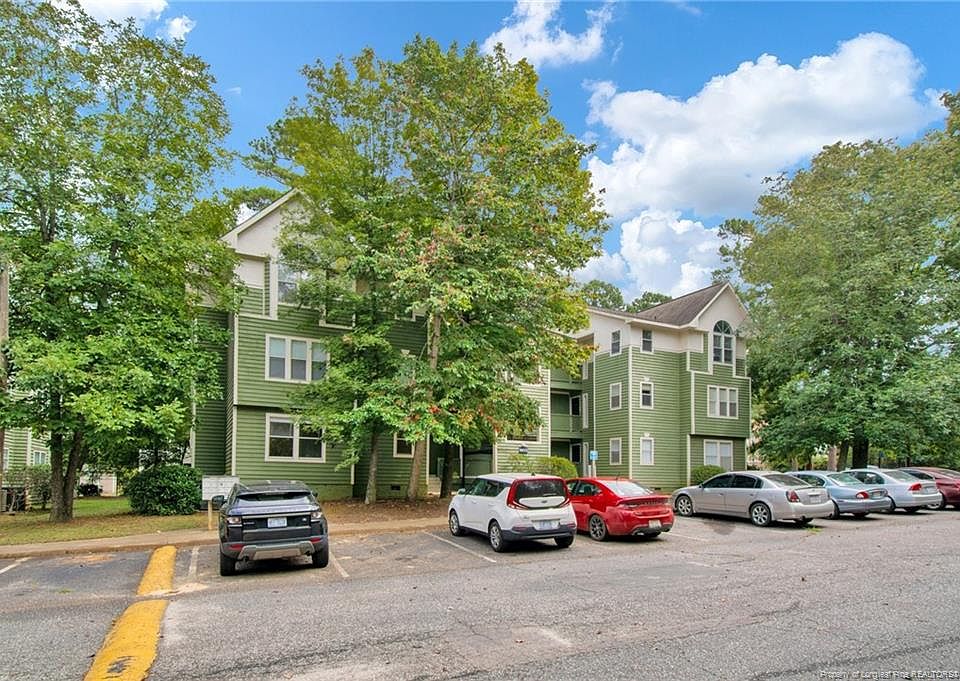 Front of building with parking spaces