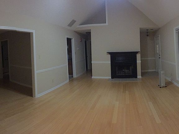 Living Area W/Vaulted Ceiling and Beautiful Blond Bamboo Flo