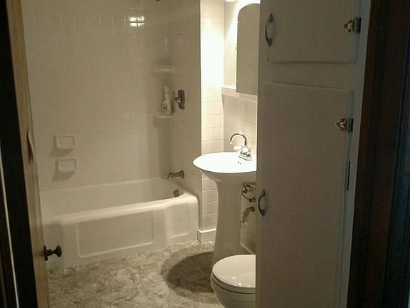 Bathroom, brand new flooring, toilet, lights.