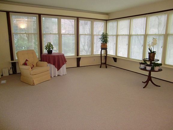 Sunroom adjacent to living room