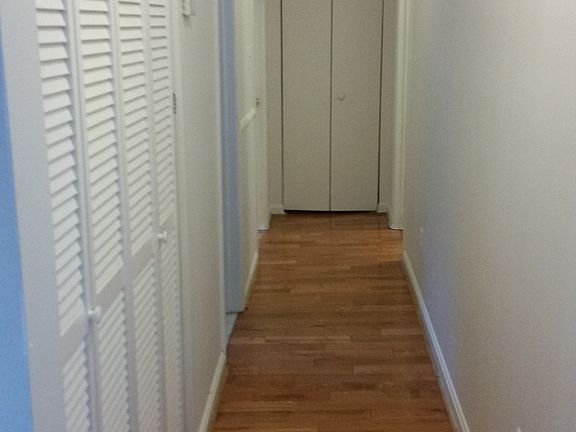 Hallway to Bedrooms with Linen Closet