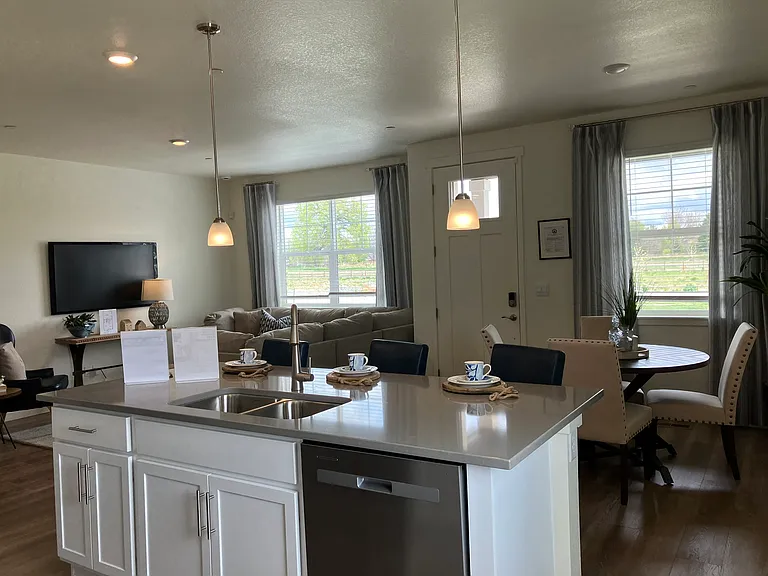 Sample of same floor plan, different finishes, staged with furniture.