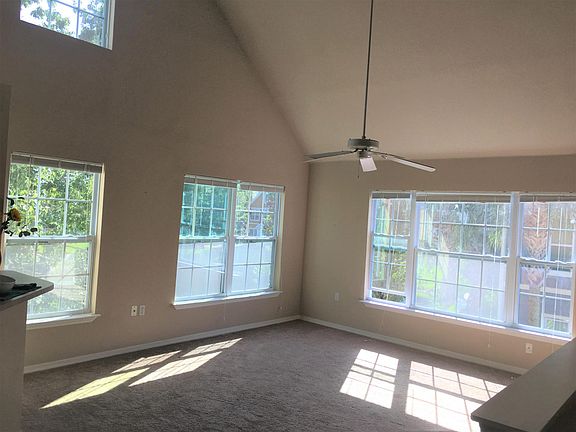 Catherdral ceilings give an airy light feel. Window blinds for all windows included.