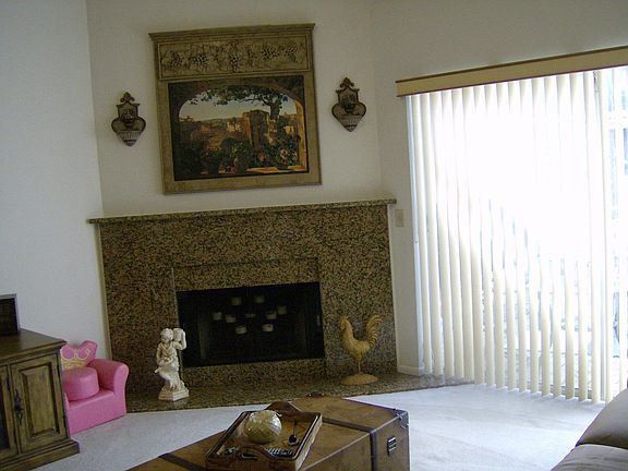 living room with wood burning fireplace