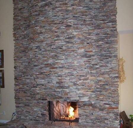DRAMATIC STACKED STONE FIREPLACE