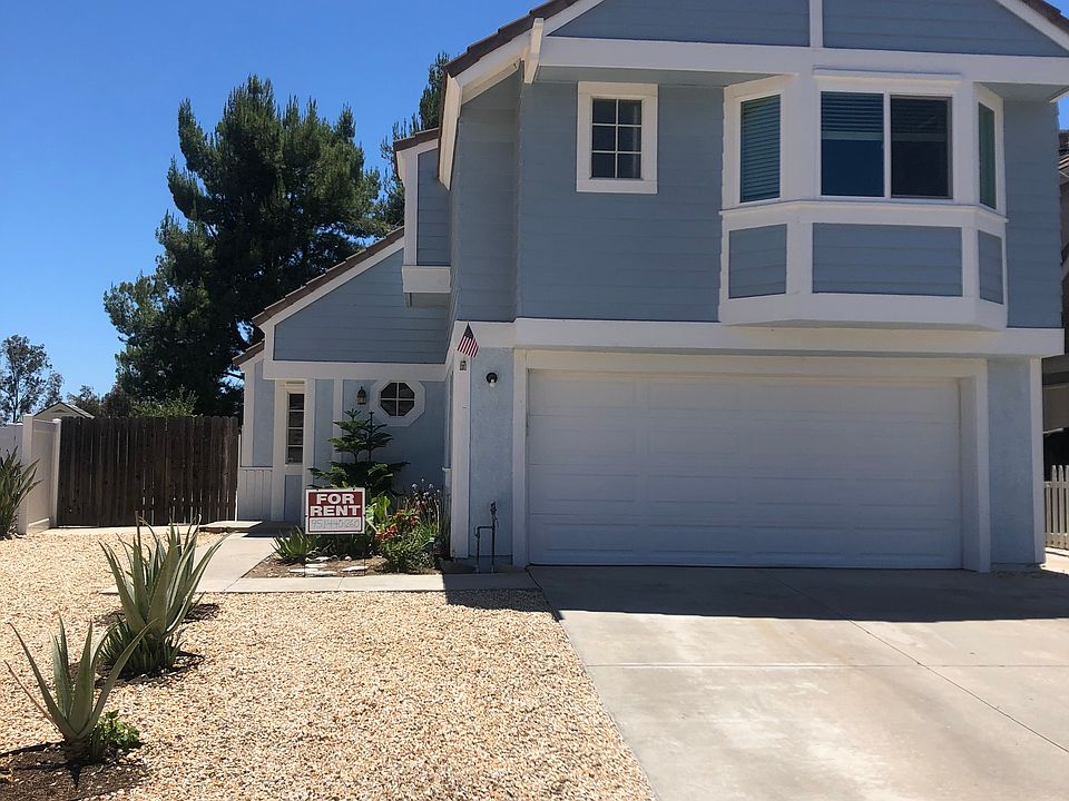 front yard, 2-car garage with opener