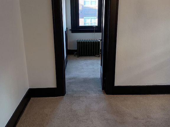 Just inside the entrance facing N towards bedroom 1