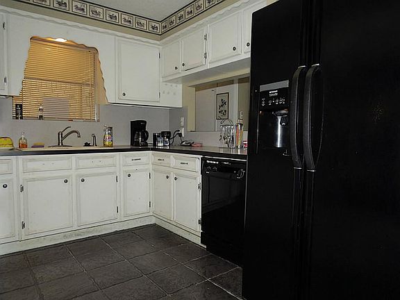 Spacious with room for a huge refrigerator.