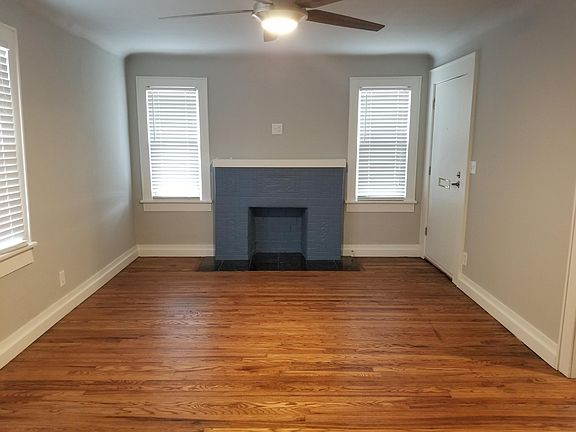 Living Room with cable and power located above mantle. All new flooring throughout the house. Heater and AC unit is new as well. Heats or cools very efficiently.