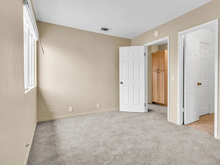 Primary Bedroom with its own access door to the full bathroom.