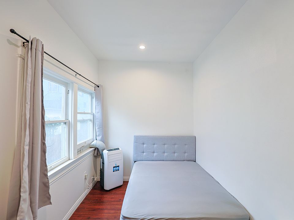 bedroom two bed, individually controlled heating/ac unit, brightly lit window