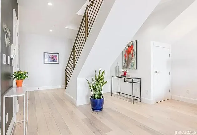 Entry hall, the stairs leading to the bedrooms and extra storage space