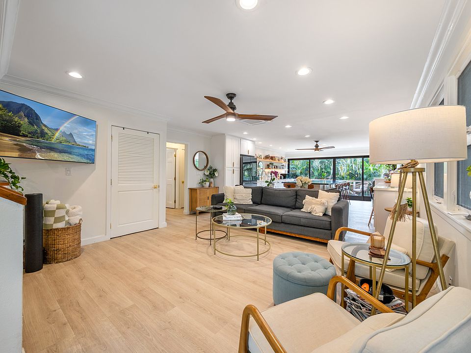 Great room with living area and kitchen is perfect for entertaining. AC throughout the home, ceiling fans, tons of natural light. In a great neighborhood walking distance to the beach and beach park, shops, restaurants and a top rated elementary school.