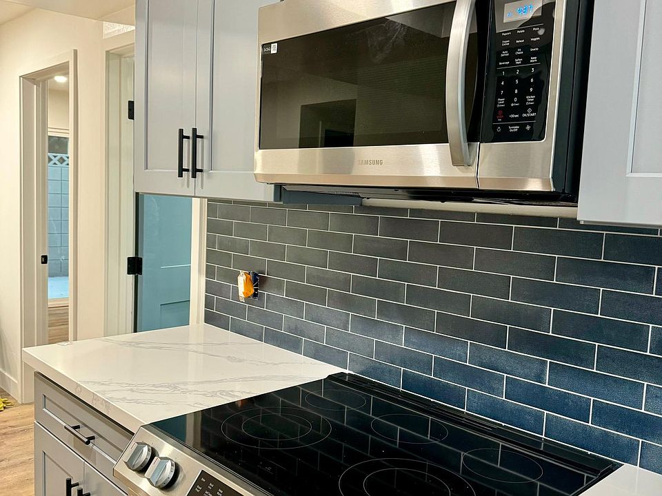 Kitchen has convenient access to walk-in pantry and dedicaed laundry room.