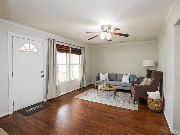 Living room has hard wood floors and lots of natural light.