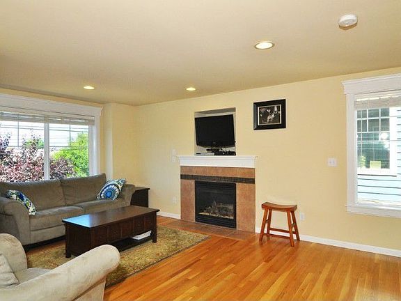 he gas fireplace is a great focal point for the living room. Oak hardwoods, wood wrapped windows and