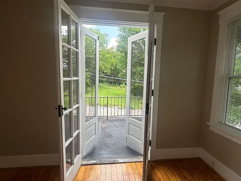 French doors leading out to a rooftop porch