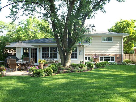Backyard with $10,000 in landscape and 450 sq. foot brick paver patio