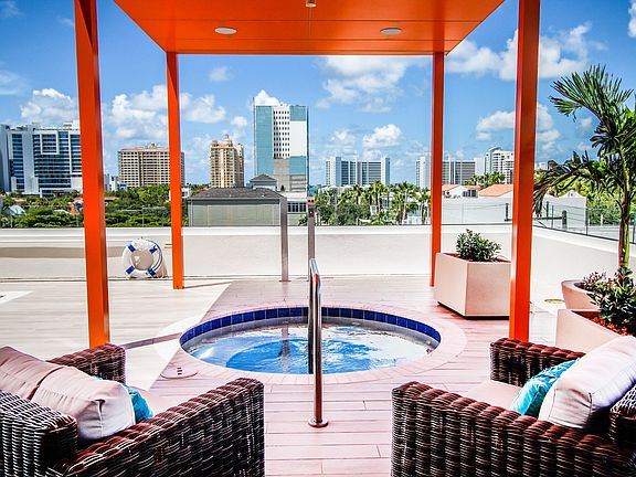 Shaded spa on elevated amenities deck