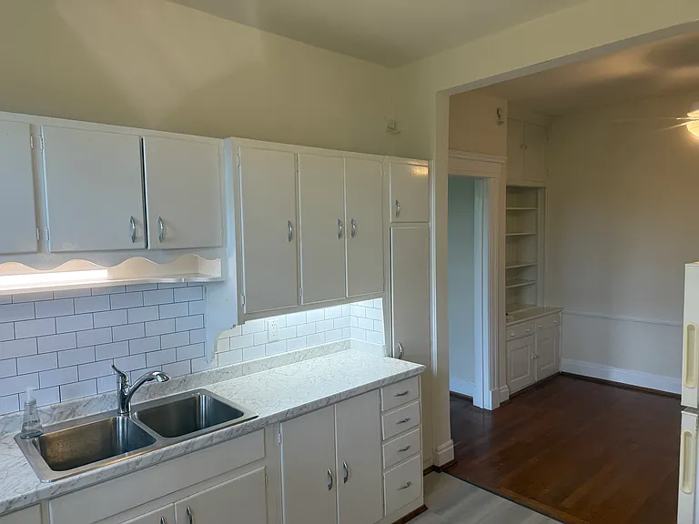 Adjoining the kitchen is the breakfast room with built in butler's pantry.