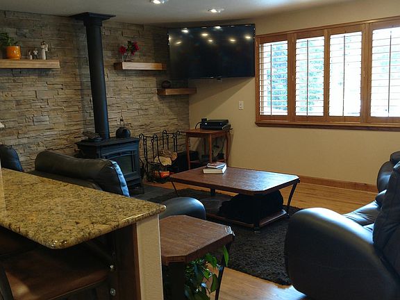 Living room view. Mountain views from front window. Wood burning stove.